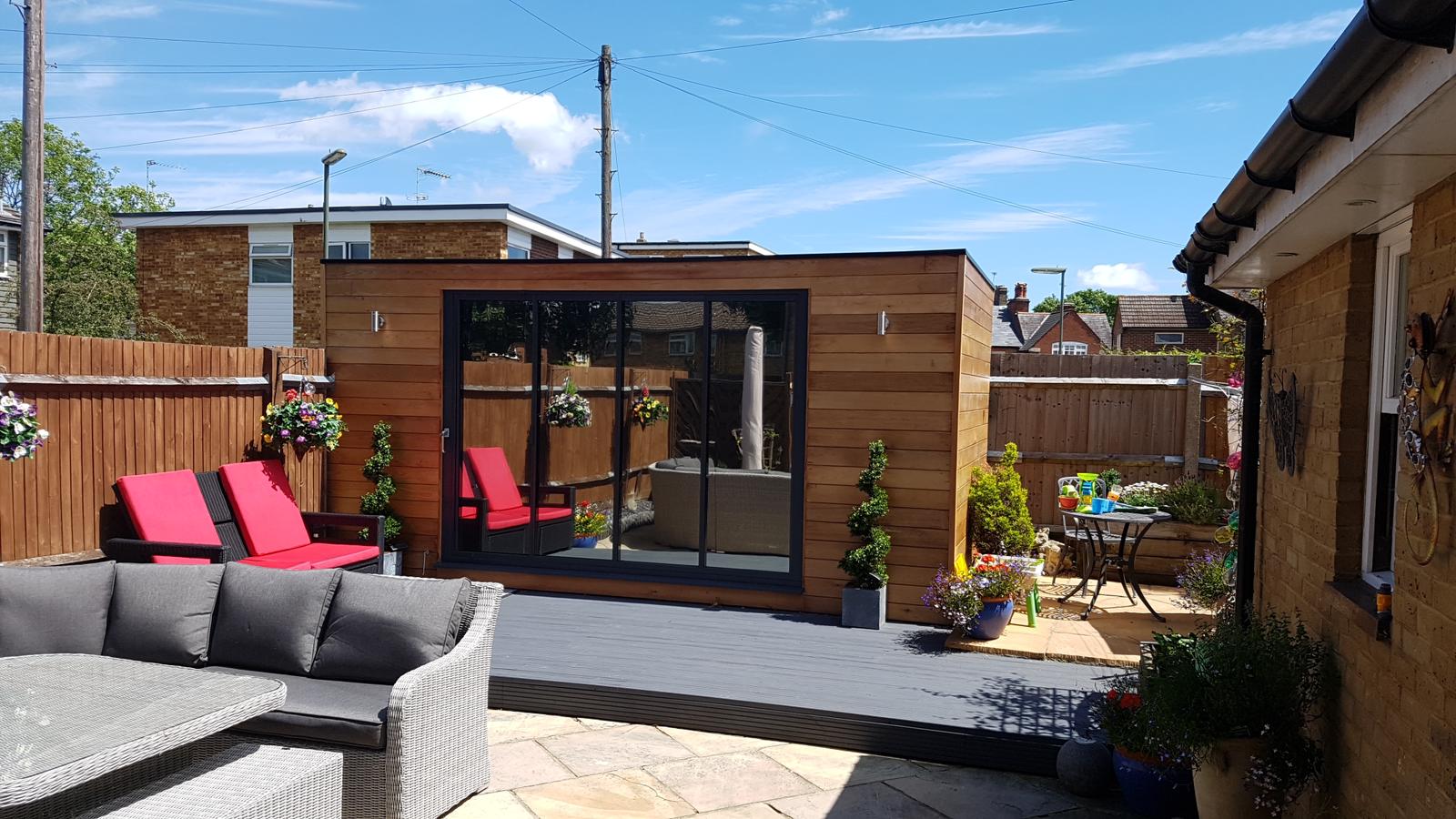 Garden entertainment room with bi-fold doors and decking